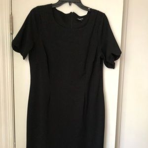 Black scalloped mini dress. Dress material.